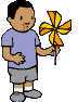 boy blowing pinwheel